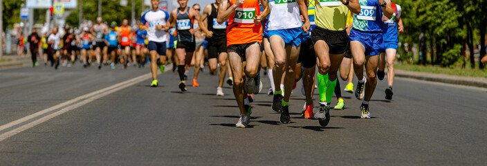 large group male runners athletes run marathon race