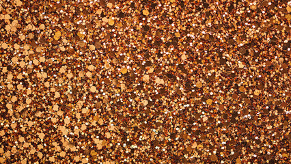 Abstract festive golden glitter textured background