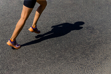 girl runner run shadow on dark road