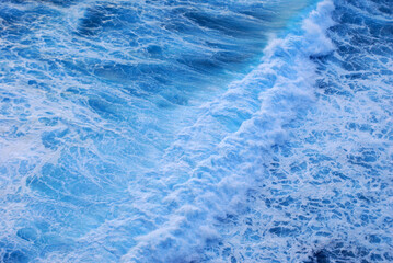 Blue sea marine ocean seascape tropical huge wave on blurred background. Seascape blue ocean white wave motion outdoor. Aqua marine huge wave sea summer background. Paradise turquoise water landscape