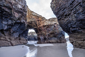 Natural rock arches Cathedrals beach, Playa de las catedrales at Ribadeo, Galicia, Spain