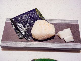 Close up shot of grilled rice ball with seaweed