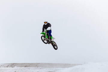 motorcycle racer jump winter enduro race