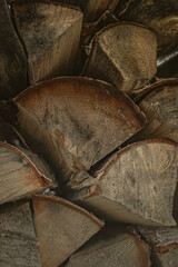 Heating the house in winter. A stack of wood. Firewood from chopped birch. Heat the stove. Chopping firewood. Warm house.