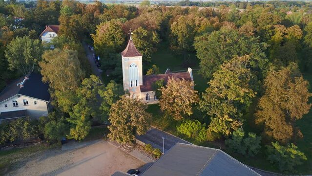 East german Place of worship In park with trees. Calm aerial view flight drone