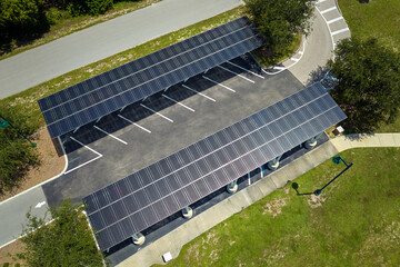 Solar panels installed over parking lot for parked cars for effective generation of clean energy © bilanol