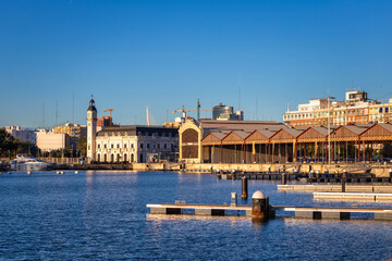 Landscape of the Port of Valencia with the clock tower at sunrise, Spain.