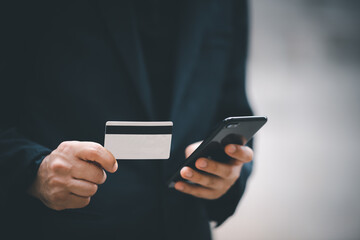 Man paying and shopping with smartphone application. Digital money transfer, banking and e commerce concept.Mobile payment with wallet app technology.