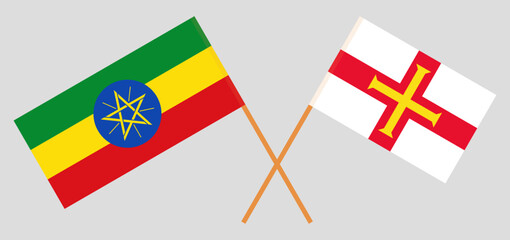 Crossed flags of Ethiopia and Bailiwick of Guernsey. Official colors. Correct proportion