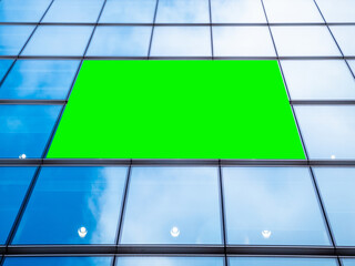 London UK - Financial district glass window skyscraper with green screen chroma key market advertisement board with billboard for targeted ads towards commuters and shoppers