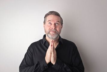 portrait of an adult man while he prays