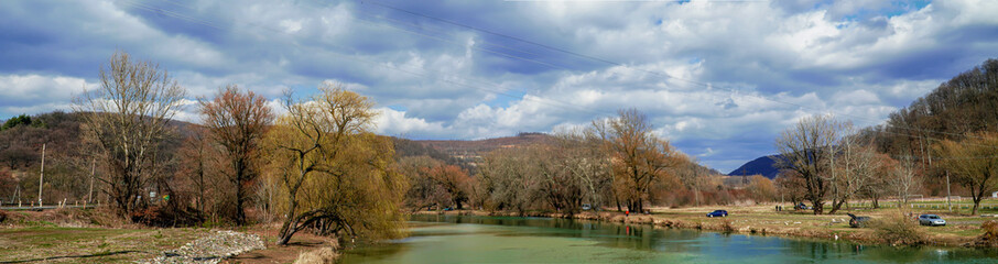 Obraz premium blue sky over the mountains, riverbed in the mountains, panorama of naturei