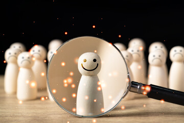 Happy wooden figure stands out from the crowd,Wood figure with happy face standing out from the...