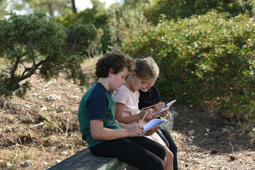 three children working in a park