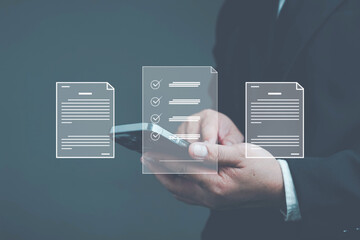 electronic document management paperless workplace electronic signature electronic signature Document worker signing electronic documents on digital documents with virtual mobile screen using finger