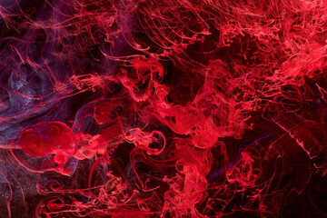 Naklejka na ściany i meble Red abstract ocean background. Splashes and waves of paint under water, clouds of smoke in motion.