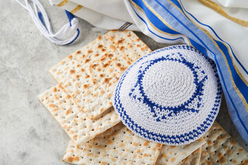 Passover celebration concept. Matzah, red kosher and walnut. Traditional ritual Jewish bread...