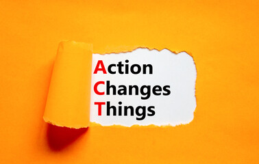 ACT action changes things symbol. Concept words ACT action changes things on white paper on a beautiful orange background. Business and ACT action changes things concept. Copy space.