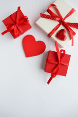 gift concept for valentine's day. red gift box and red heart isolated on white background