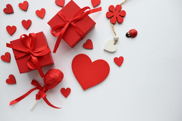 gift concept for valentine's day. red gift box and red heart isolated on white background