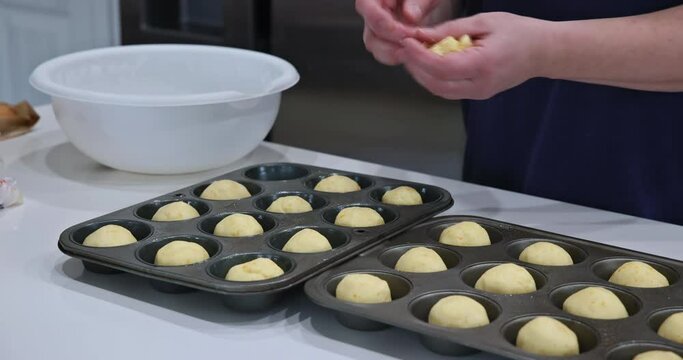 Preparation and baking of traditional cheese buns Brazilian snack at homemade