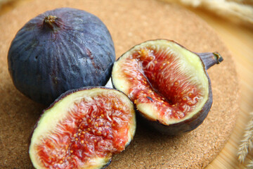 fresh figs cut on a wooden table