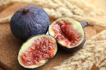 fresh figs cut on a wooden table