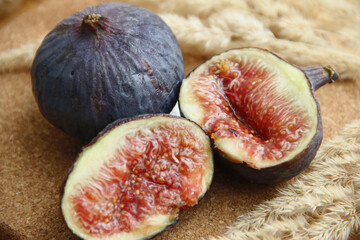 fresh figs cut on a wooden table