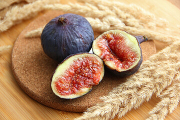 fresh figs cut on a wooden table