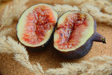 fresh figs cut on a wooden table