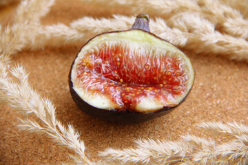 fresh figs cut on a wooden table