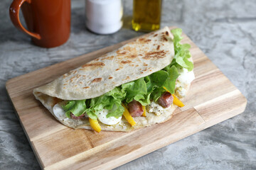 Italian cuisine , Piadina with sausage and cheese