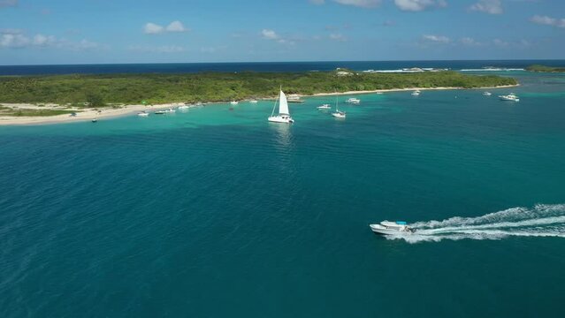 Aerial Drone view of a boat running near a tropical caribbean island. In Cayo Icacos Puerto Rico