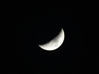 Obraz na płótnie Canvas Crescent moon shining in the dark sky