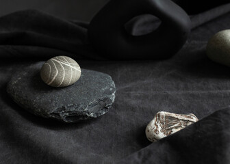 still life of stones on a dark background with an empty space