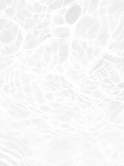 Defocus blurred transparent white colored clear calm water surface texture with splashes and bubbles. Trendy abstract nature background. Water waves in sunlight with copy space. White water shine