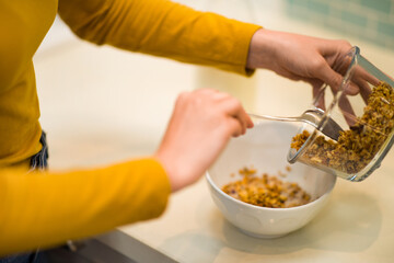 Cropped of female hands making breakfast at home