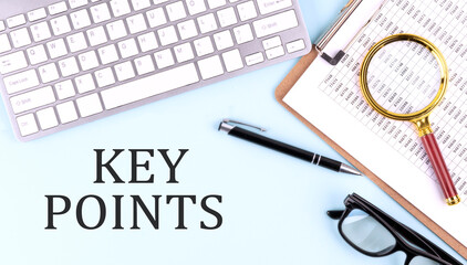 KEY POINTS text on blue background with keyboard and clipboard, business concept