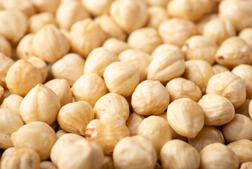 Close up shot of hazelnuts. Peeled hazelnuts background