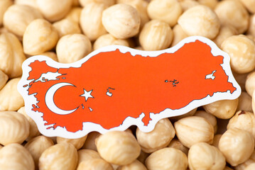 Flag and map of Turkey on hazelnuts. Concept of growing hazelnuts in Turkey, origin of nuts