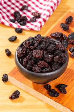 Healthy Food - Nuts Dehydrated Grapes; Photo On Wooden Background