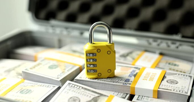 Locked combination lock and hundred dollar wad of money