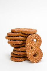 Stack of figured shortbread cookies with crystal sugar isolated on white background with copy space