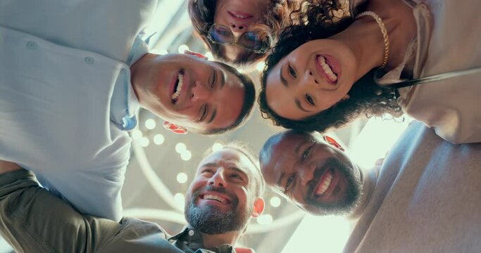 Teamwork, collaboration and huddle of business people in office or workplace with low angle. Team building, solidarity and group of employees hug for unity, union and motivation, goals and targets.