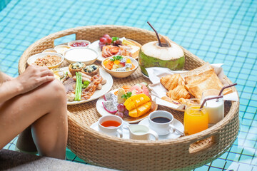 Floating breakfast tray in luxury poolside hotel