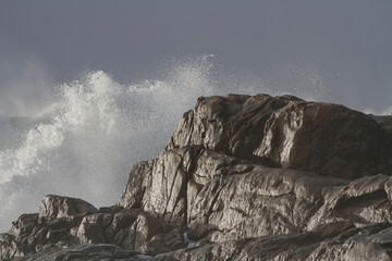 Glistening wet sea cliff