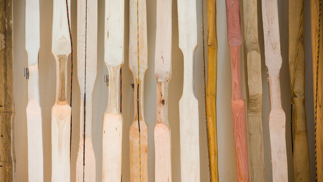 Hand-crafted bows lean against a wall in a Lake Pleasant, Massachusetts home.