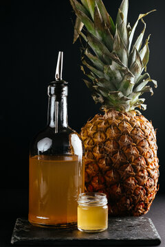 berry tinctures in shorts with fruit and berries on the backgrou
