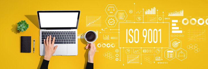 ISO 9001 theme with person using laptop computer
