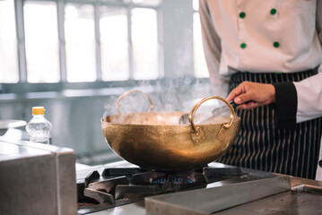 Close up chef cooking in the kitchen.